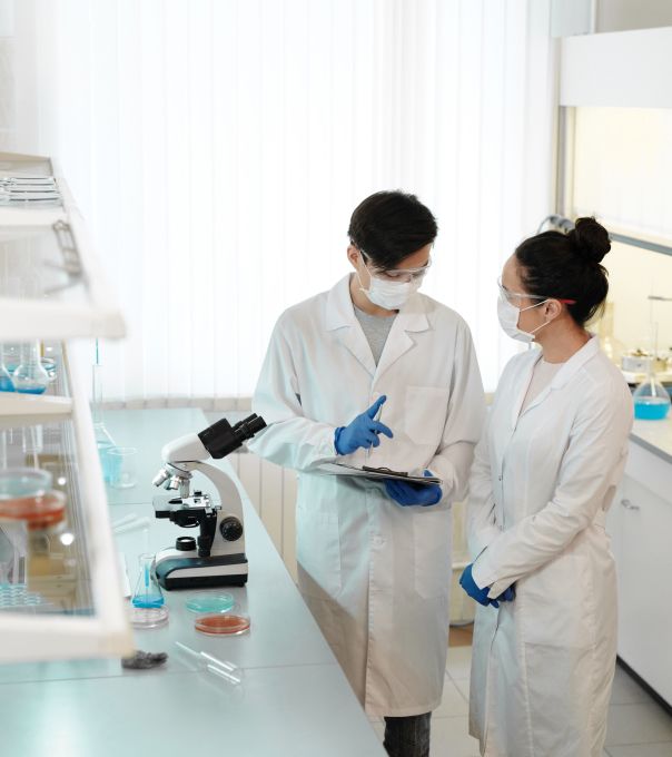 Two technicians reviewing results in a laboratory